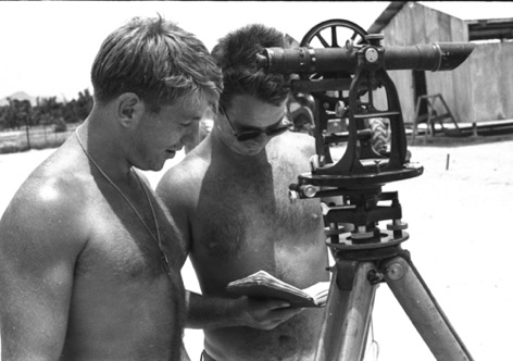 Two surveyors from Engineering, EA3 Boyle and Poor, lay out the building plan for the 30 buildings the detachment will erect, once the concrete foundations are poured.